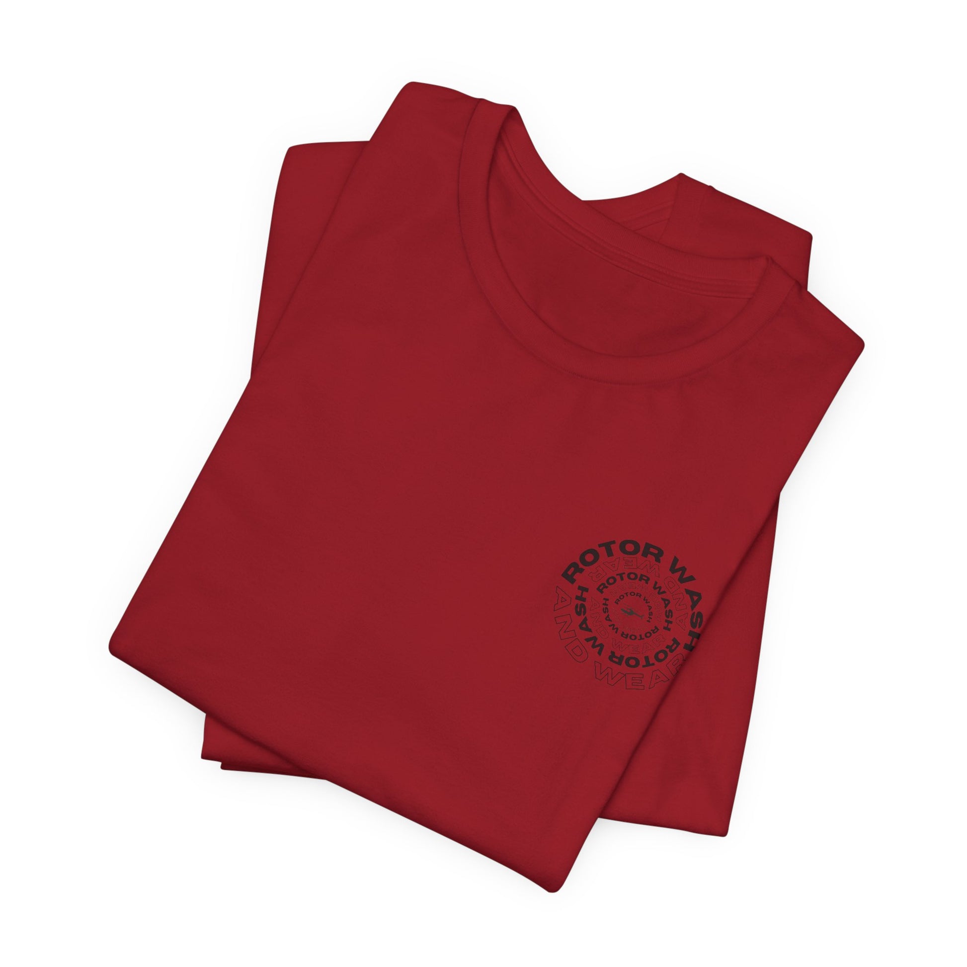 Folded red t-shirt with 'Rotor Wash and Wear' circular design text design on the left chest on a white background