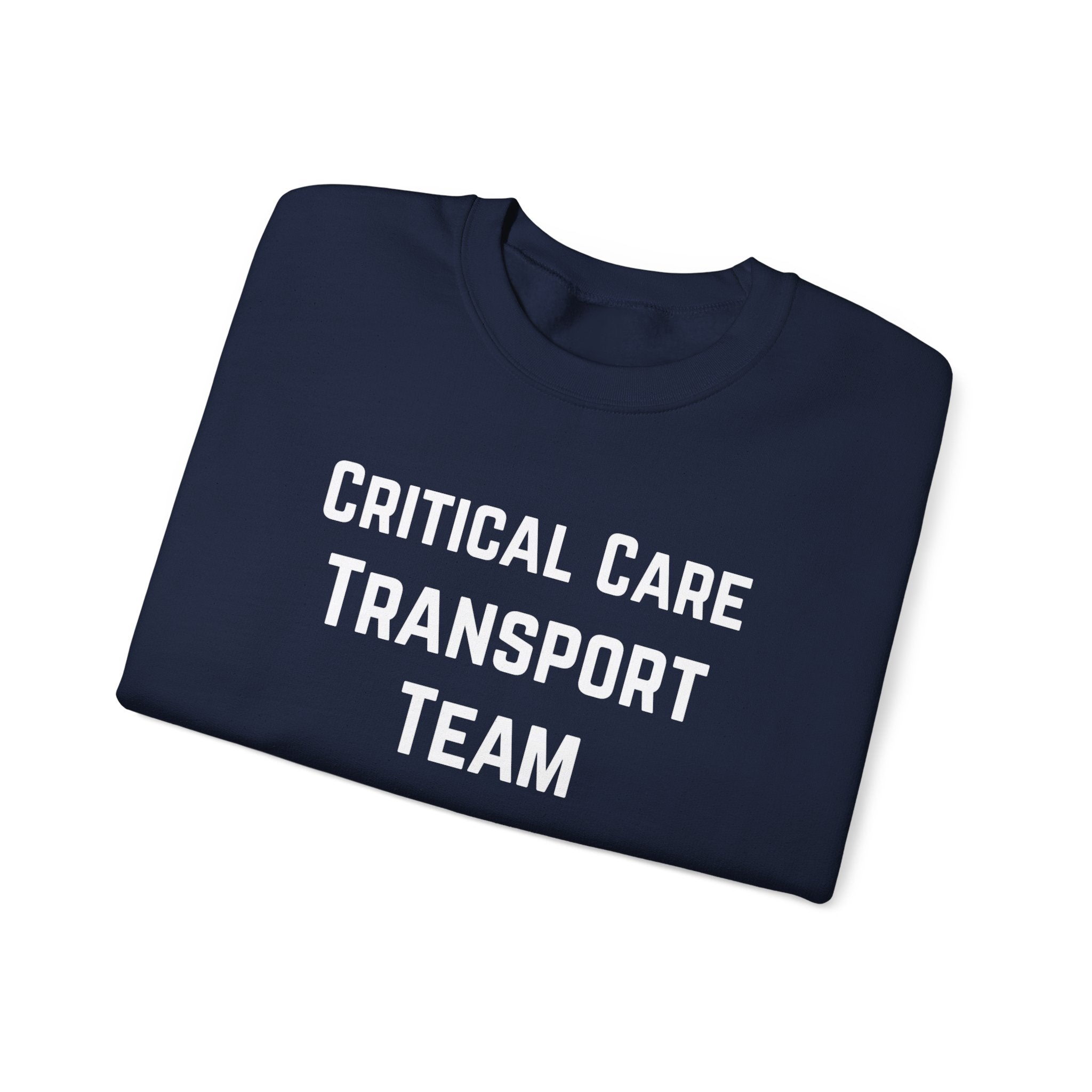 Folded navy sweatshirt with 'Critical Care Transport Team' text by Rotor Wash & Wear