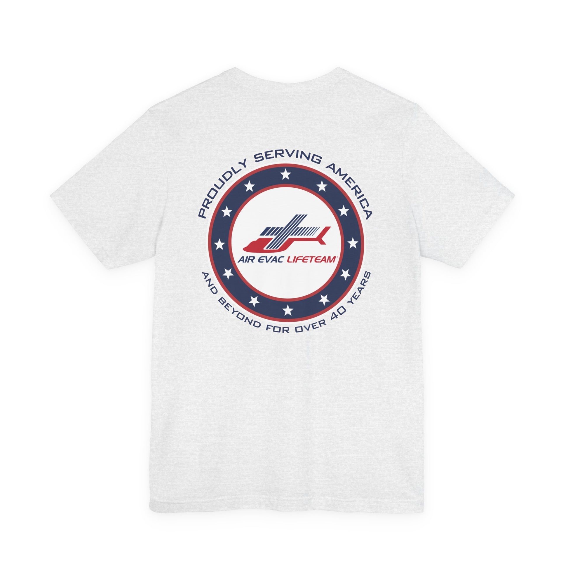 White t-shirt with a patriotic Air Evac Lifeteam logo and text 'Proudly serving America and beyond for over 40 years' by Rotor Wash & Wear