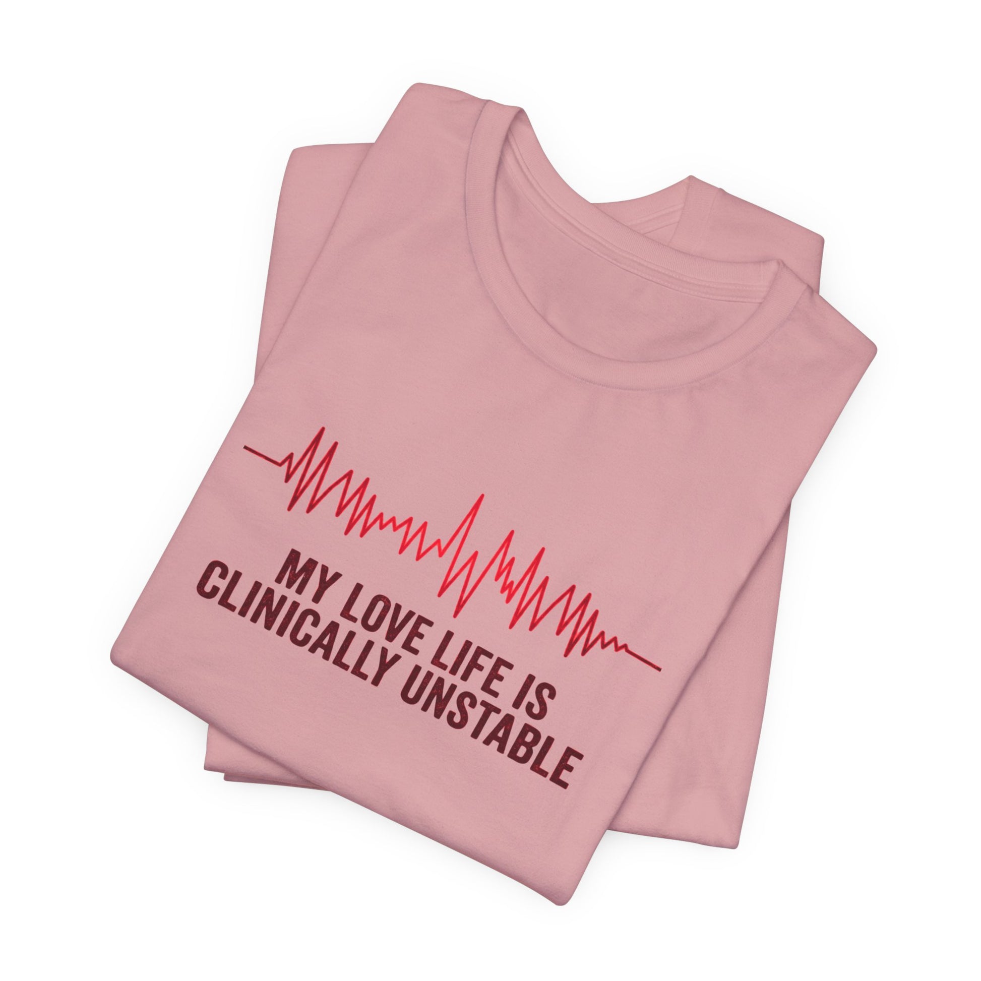 Folded pink t-shirt ventricular fibrillation cardiac rhythm and text "My love life is clinically unstable" by Rotor Wash & Wear