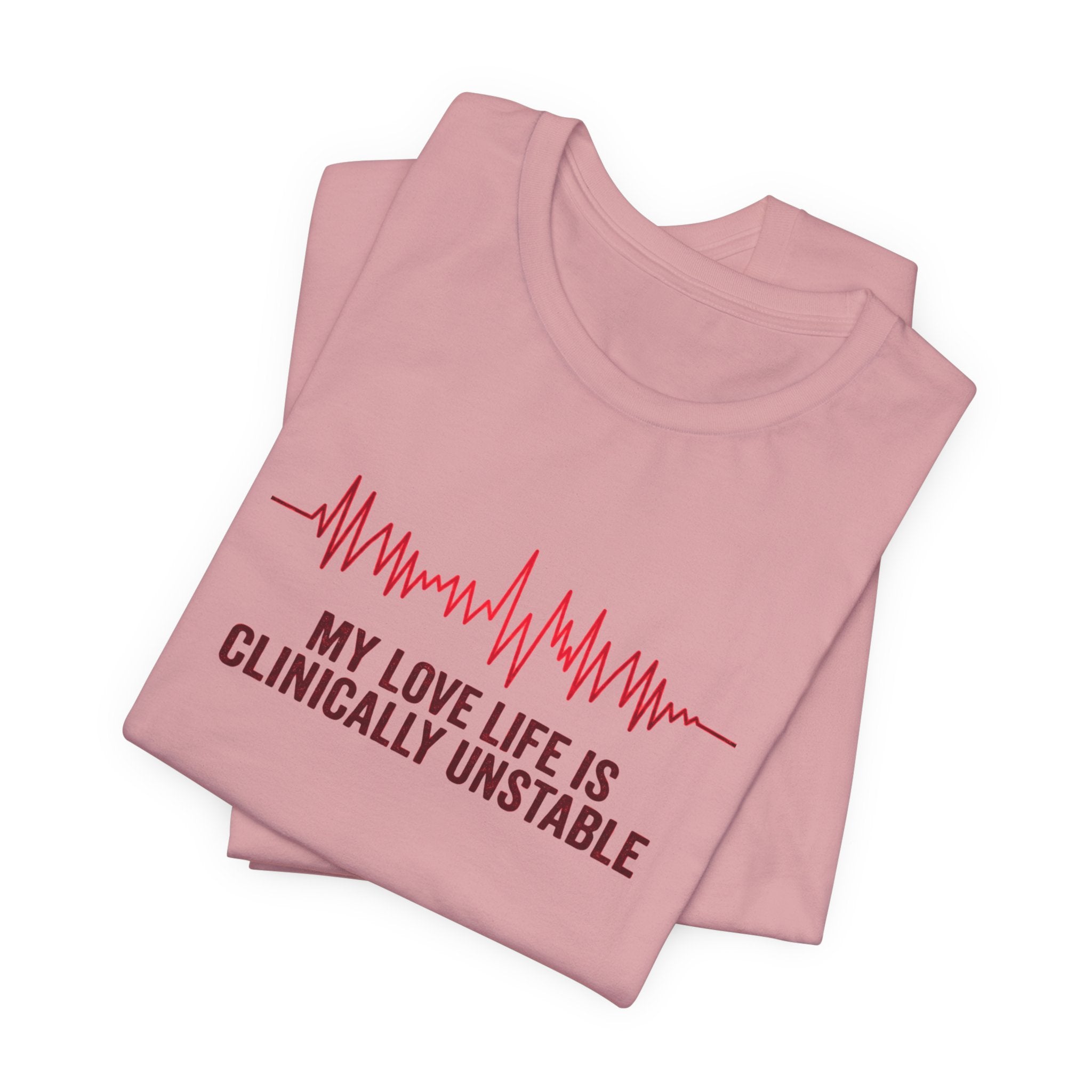 Folded pink t-shirt ventricular fibrillation cardiac rhythm and text "My love life is clinically unstable" by Rotor Wash & Wear