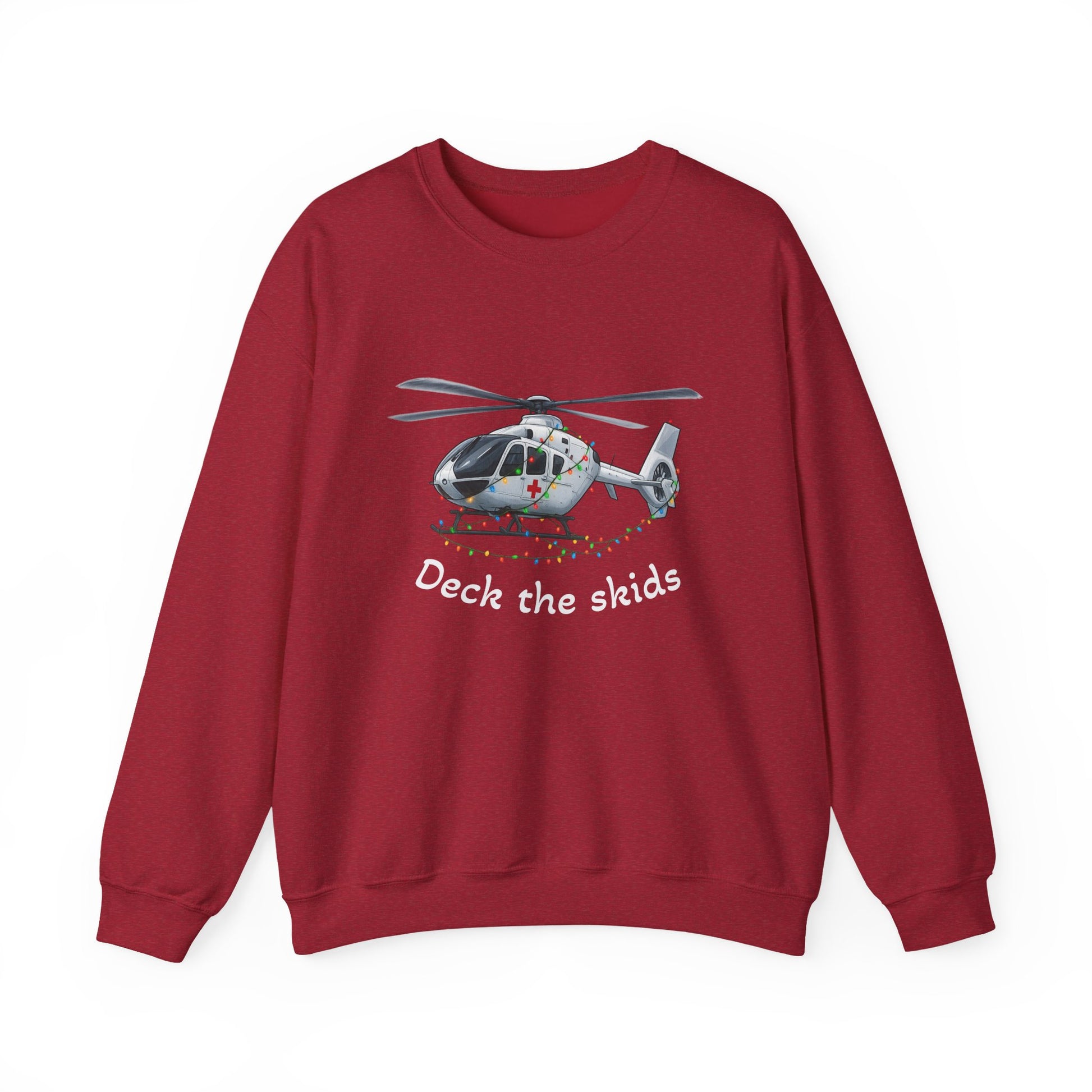 Red sweatshirt with a medical helicopter graphic wrapped in Christmas lights and text "deck the skids" by Rotor Wash & Wear