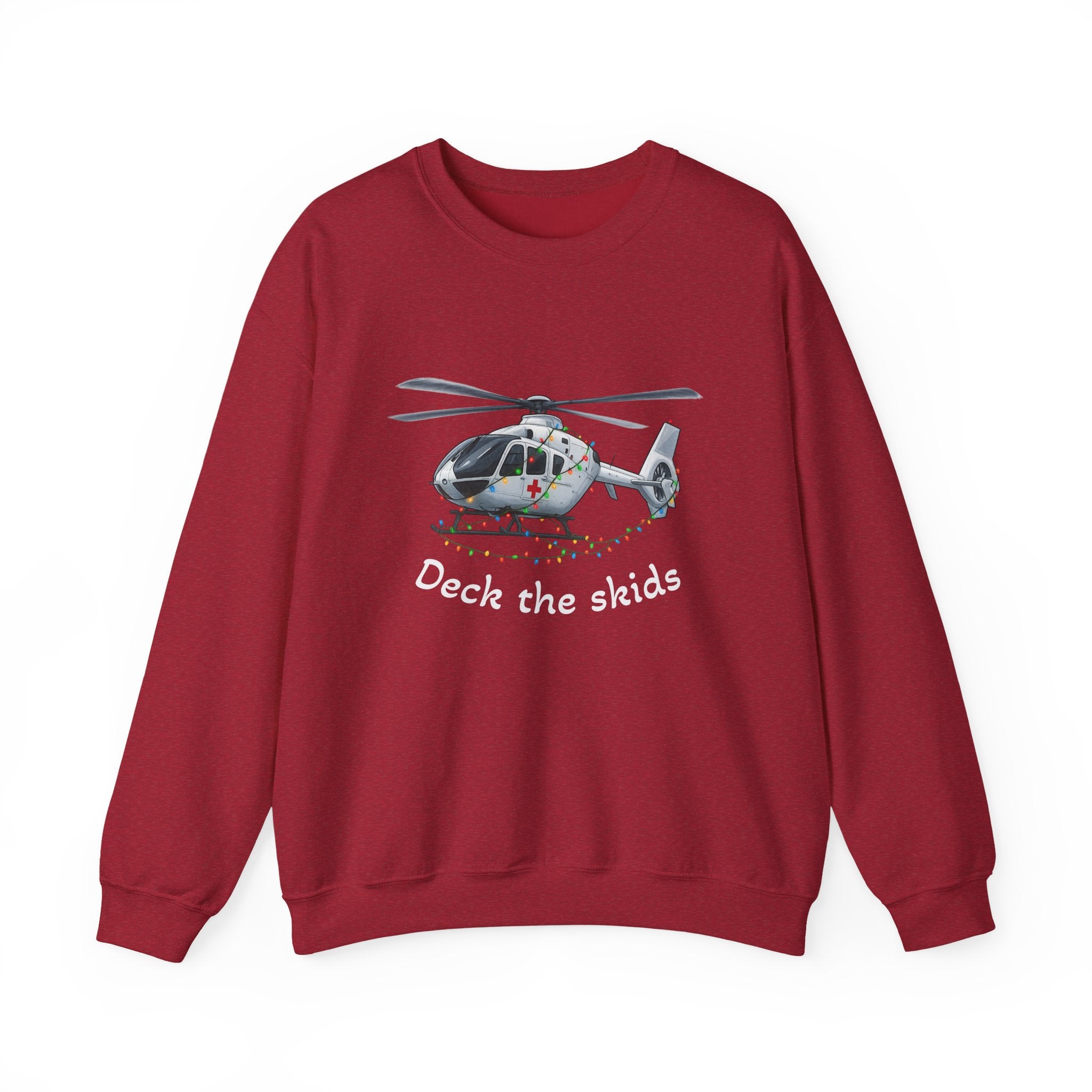 Red sweatshirt with a medical helicopter graphic wrapped in Christmas lights and text "deck the skids" by Rotor Wash & Wear