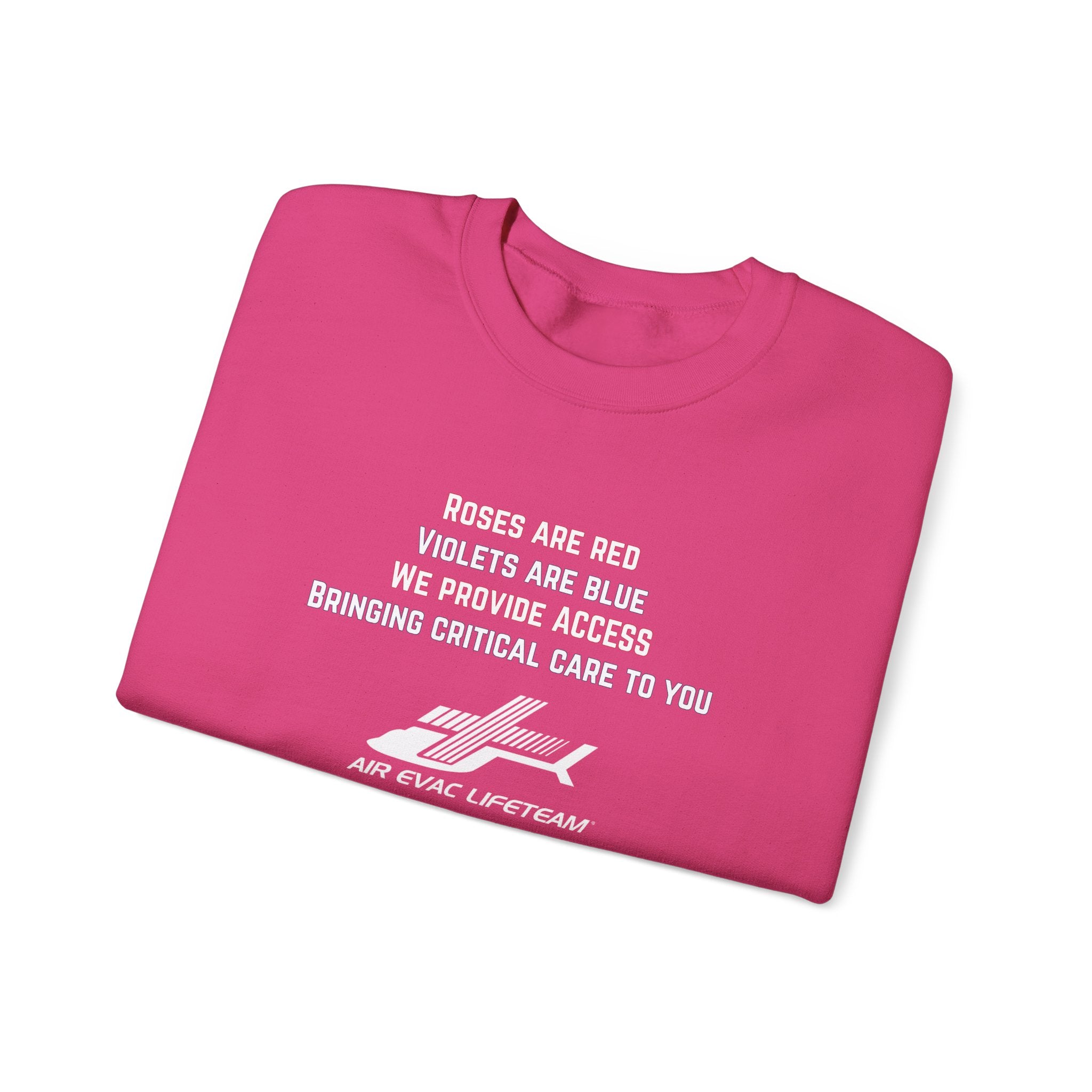 Folded pink crewneck sweatshirt with Valentine's day poem and Air Evac Lifeteam logo on a white background