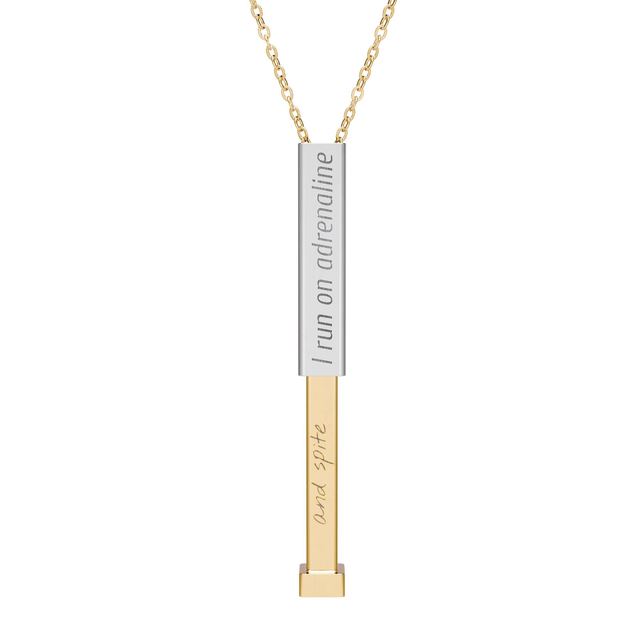 Silver and gold two-toned necklace with a cylindrical pendant engraved with 'I run on adrenaline' with hidden interior engraving "and spite" by Rotor Wash & Wear