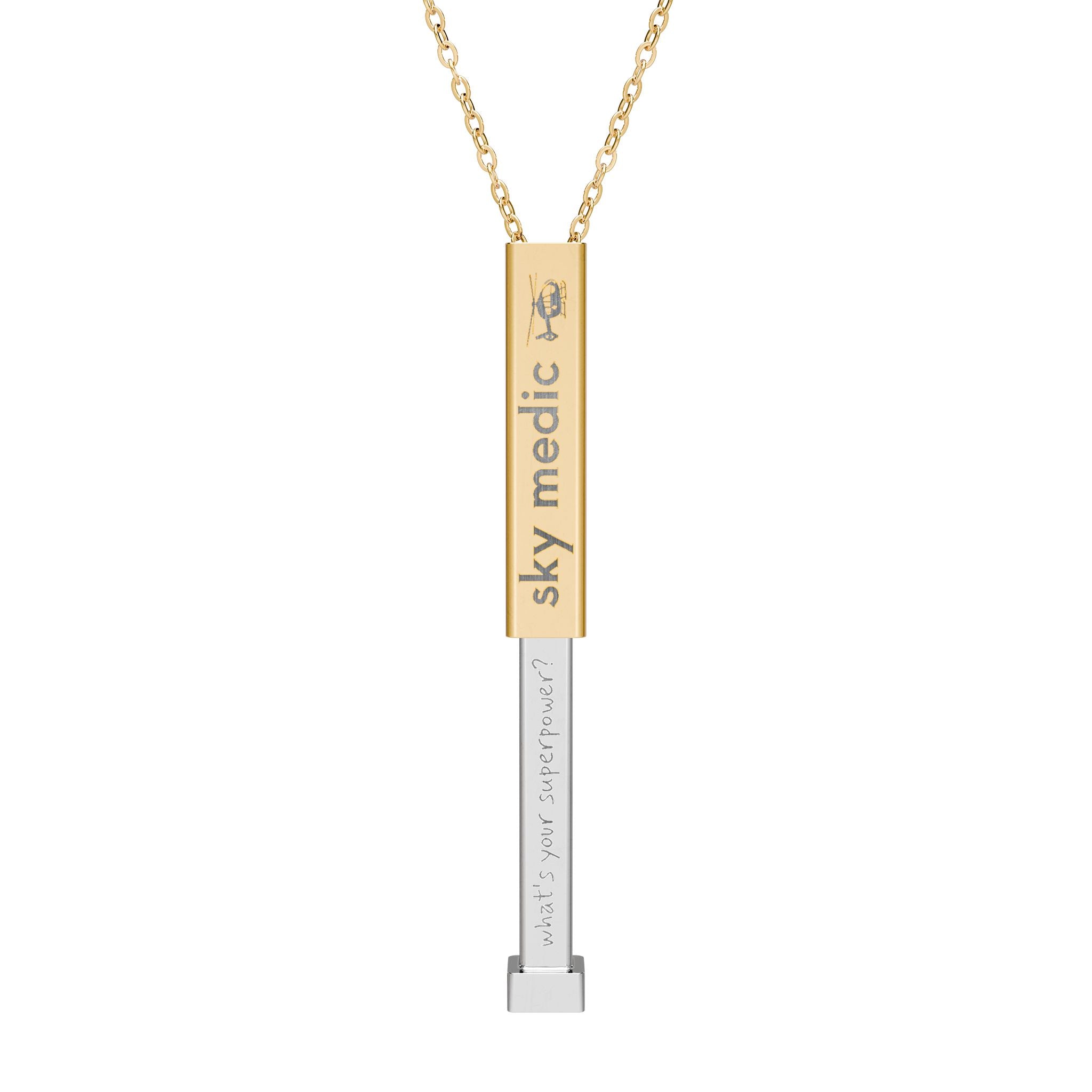 Silver and gold two-toned necklace with a cylindrical pendant engraved with 'sky medic' with hidden interior engraving "What's your superpower?" by Rotor Wash & Wear