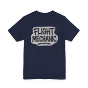 Navy blue t-shirt with graffiti style 'FLIGHT MECHANIC' text on the back against a white background