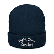 Navy blue beanie with 'Flight Crew Sanchez' embroidery on a white background