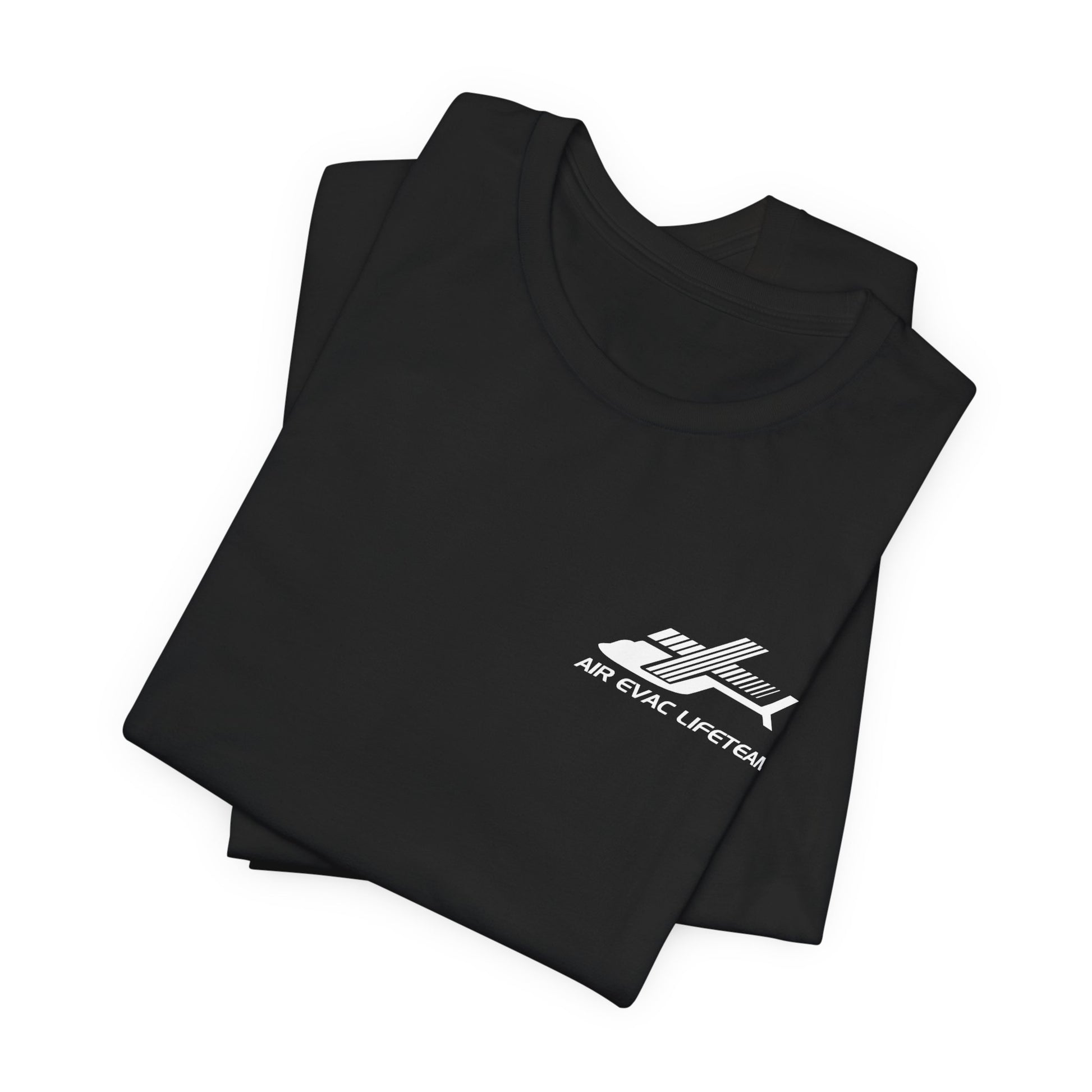 Folded black t-shirt with a white Air Evac Lifeteam logo on a white background