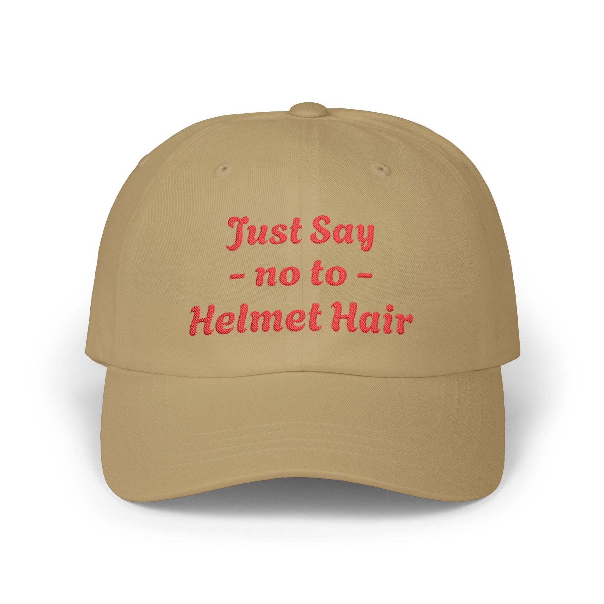 Beige cap with red text 'Just Say no to Helmet Hair' on a white background