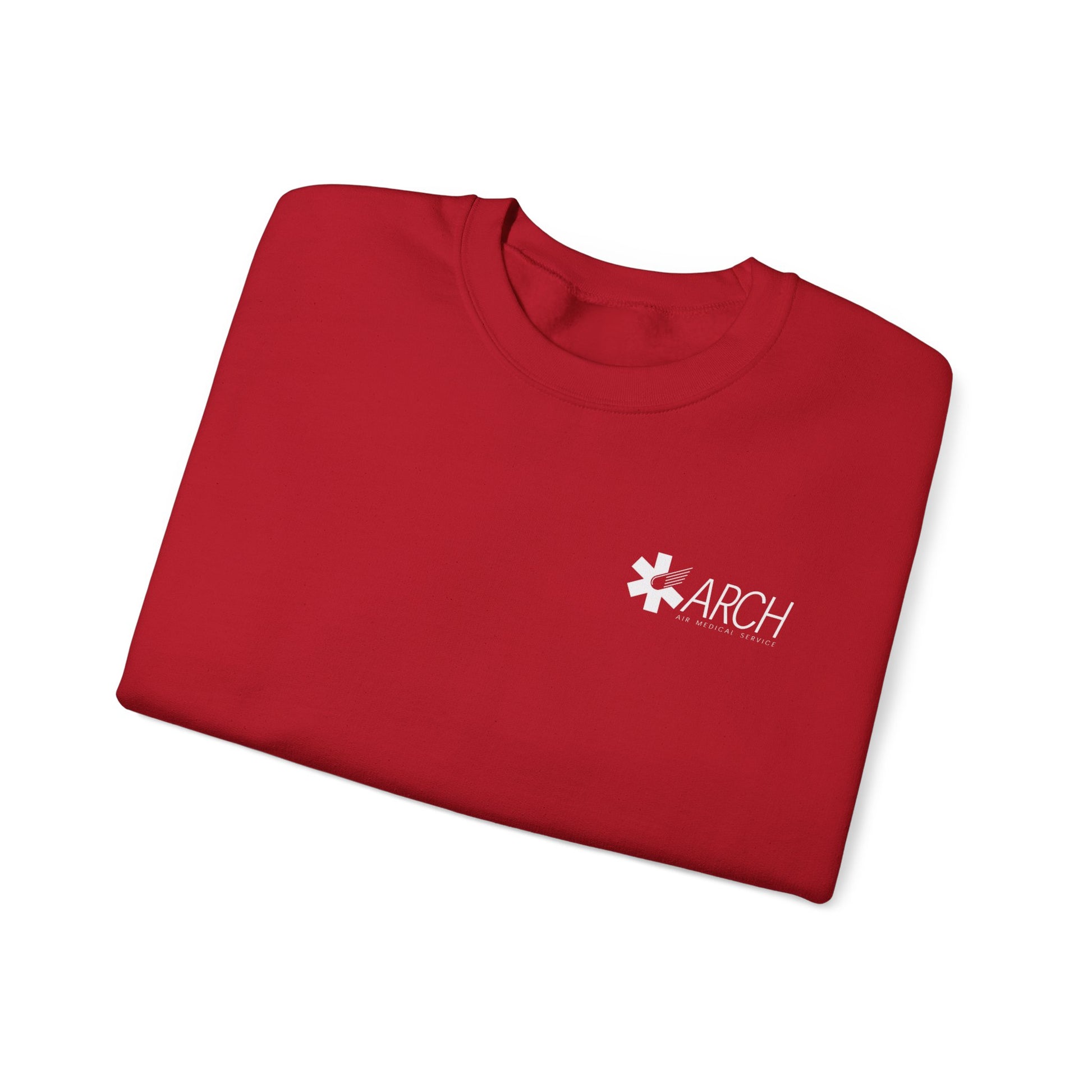 Folded red crewneck sweatshirt with a small ARCH by Air Methods logo on the left chest by Rotor Wash & Wear