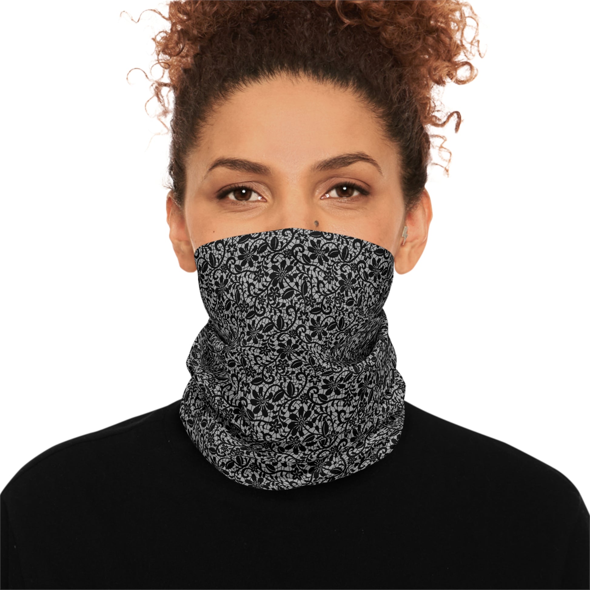Person wearing a black and gray lace patterned neck gaiter by Rotor Wash & Wear
