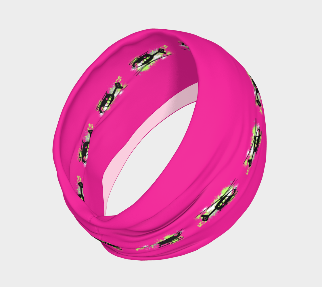 Pink headband with black helicopter design and green patterns on a light gray background