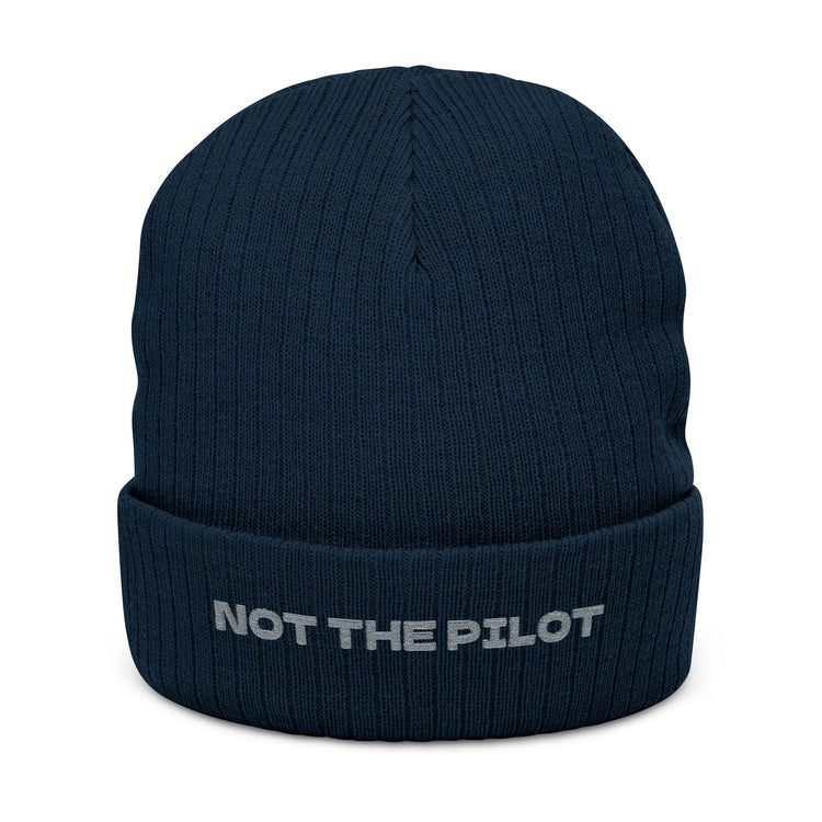 Navy blue beanie with 'NOT THE PILOT' text on a white background