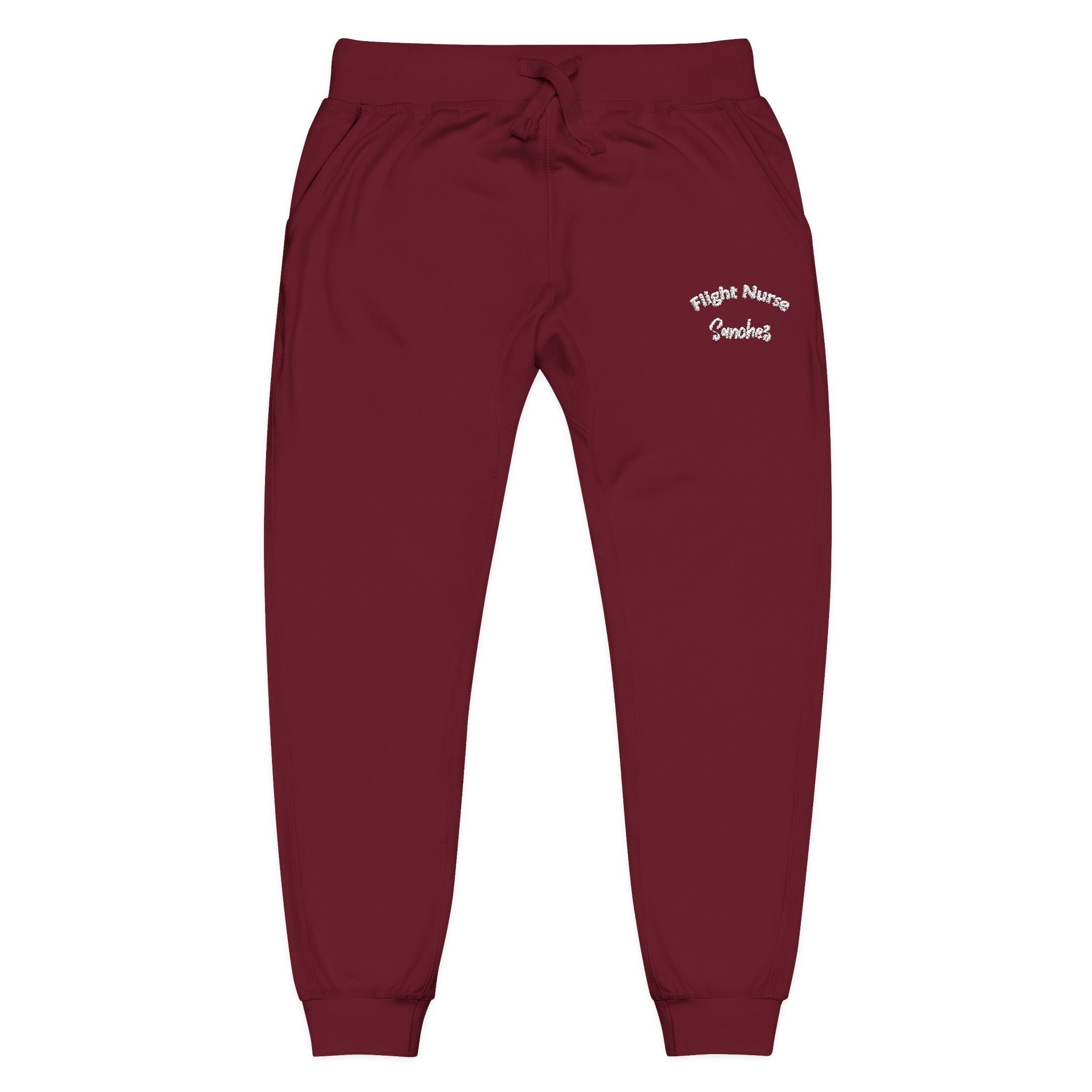 Maroon joggers with embroidered 'Flight Nurse Sanchez' text on the thigh against a white background