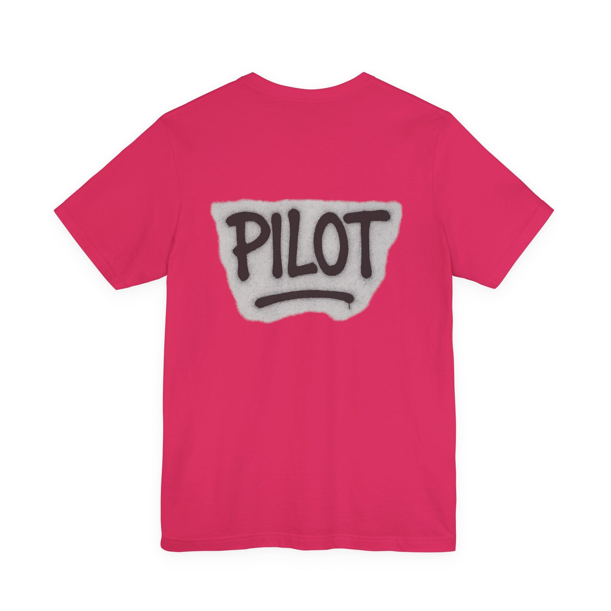 Pink t-shirt with graffiti style 'PILOT' text printed on the back against a white background
