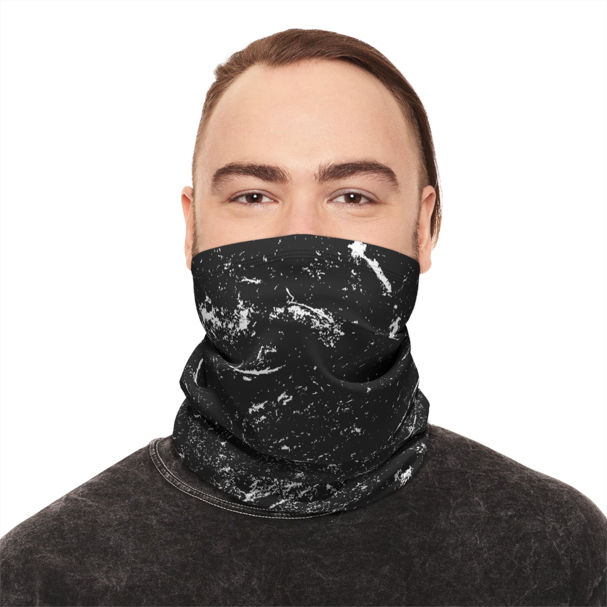 Person wearing a black and white distressed patterned neck gaiter by Rotor Wash & Wear