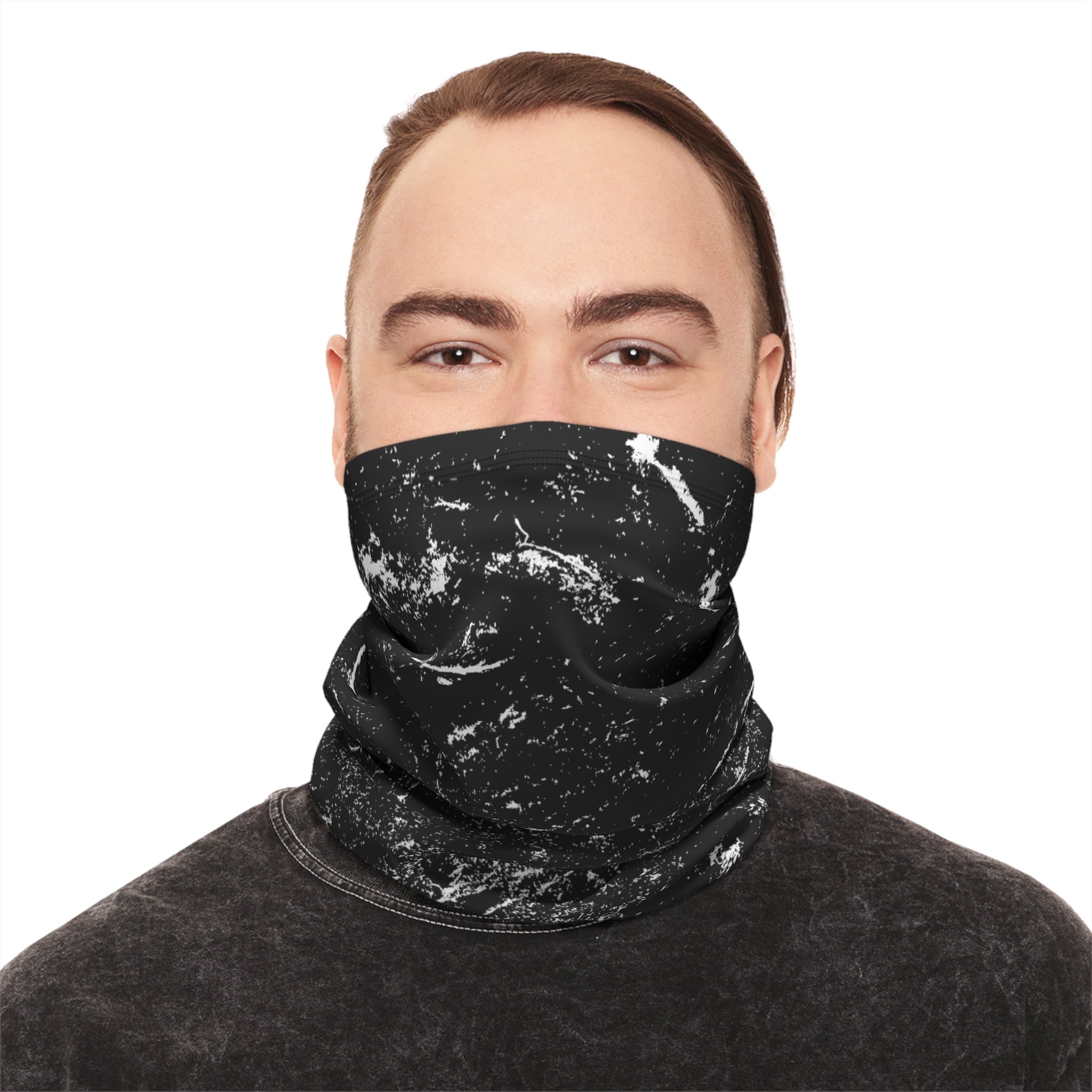 Person wearing a black and white distressed patterned neck gaiter by Rotor Wash & Wear