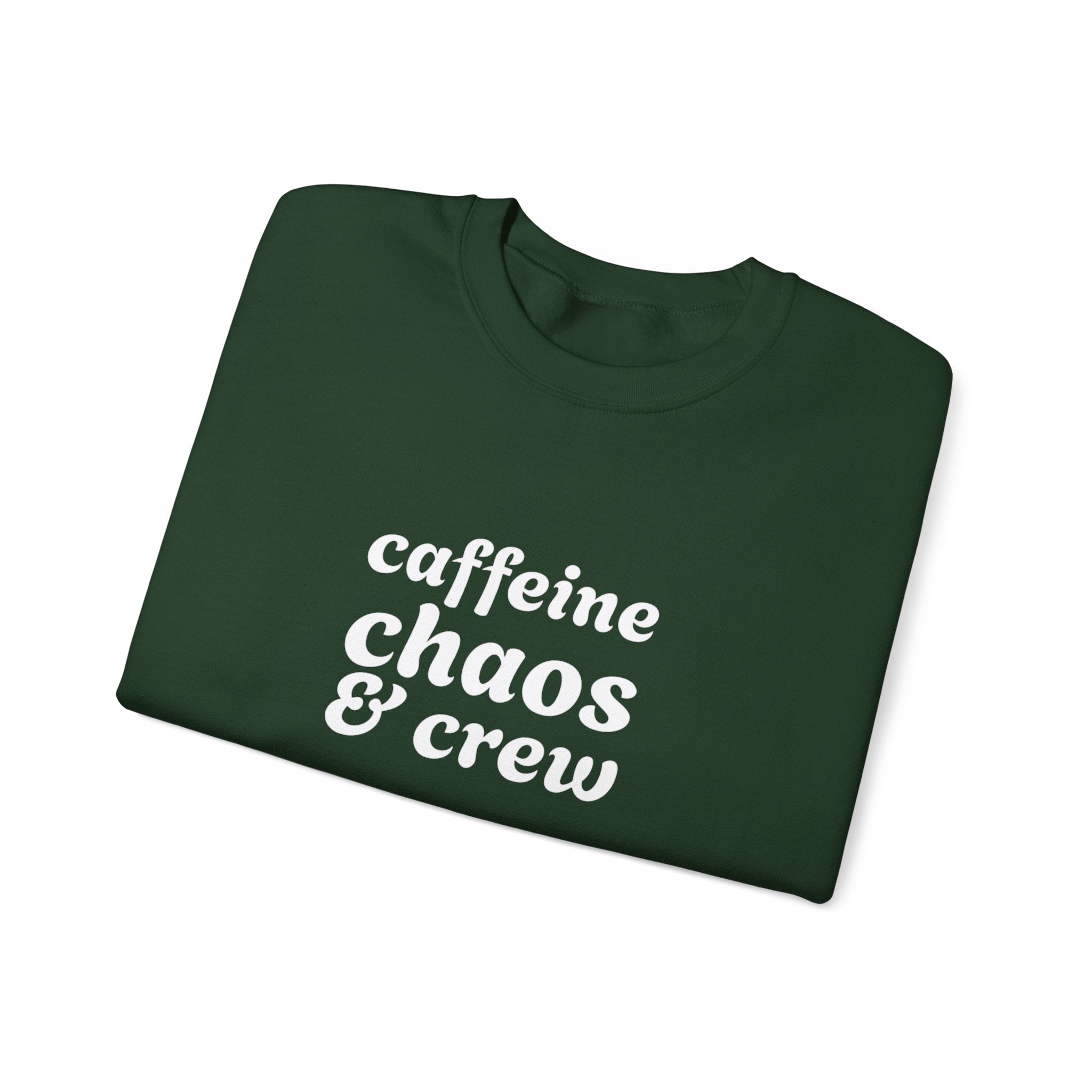 Folded green sweatshirt with 'caffeine chaos & crew' text on by Rotor Wash & Wear