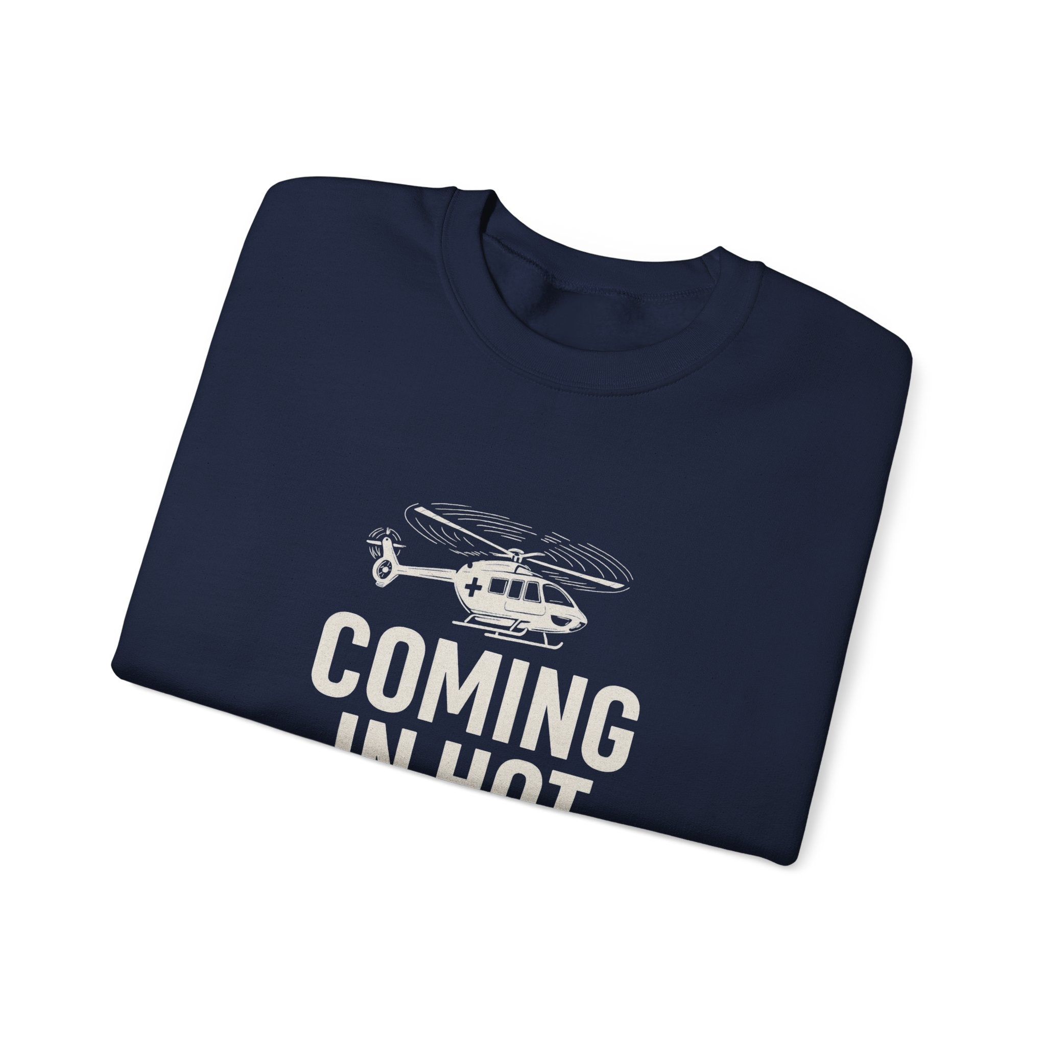 Folded navy sweatshirt with helicopter graphic and text 'COMING IN HOT' by Rotor Wash & Wear