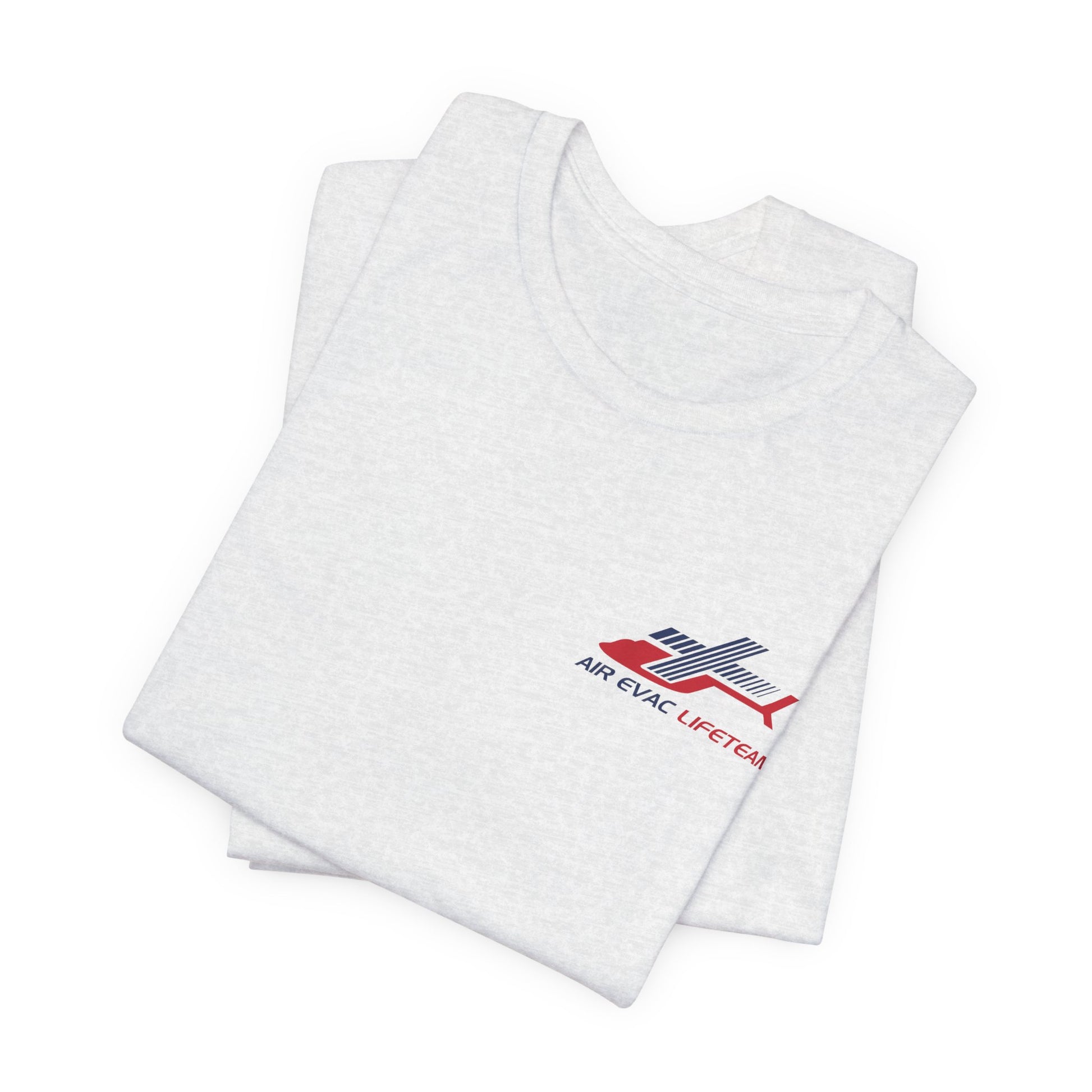 Folded light gray t-shirt with an Air Evac Lifeteam logo on a white background