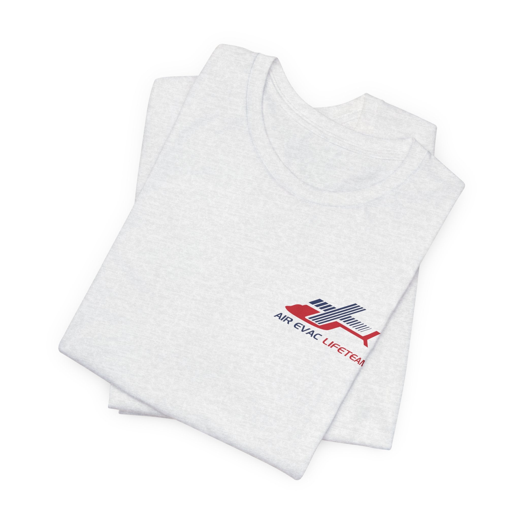 Folded light gray t-shirt with an Air Evac Lifeteam logo on a white background