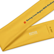 Yellow headband with dark blue text "saving lives begins with kindness" by EMS Avenger and Rotor Wash & Wear
