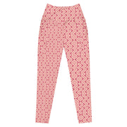 High waisted peach leggings with dark pink arrow pattern by Rotor Wash & Wear
