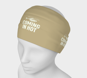 Beige headband with 'Coming In Hot' text and helicopter graphic on a mannequin head against a white background