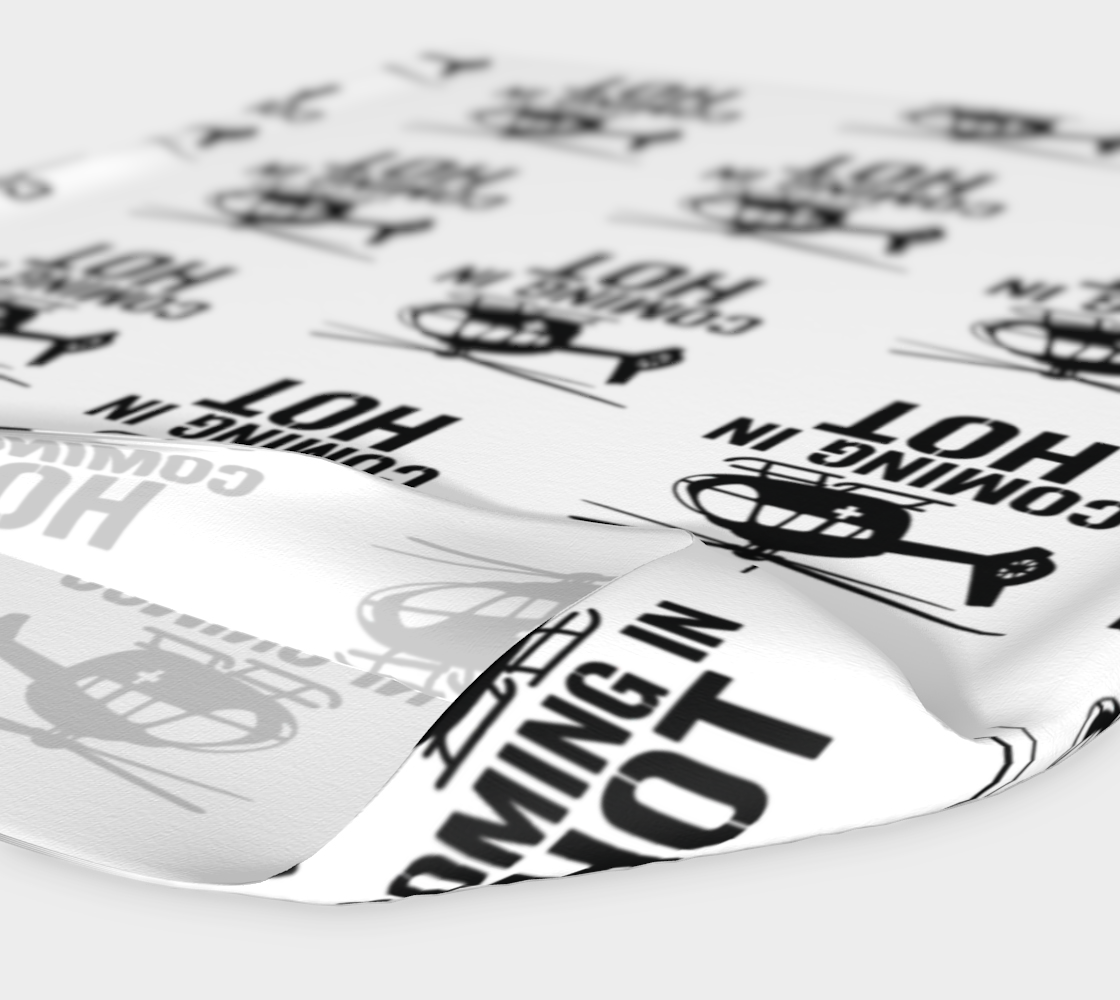 White headband with black text "coming in hot" and helicopter graphic 