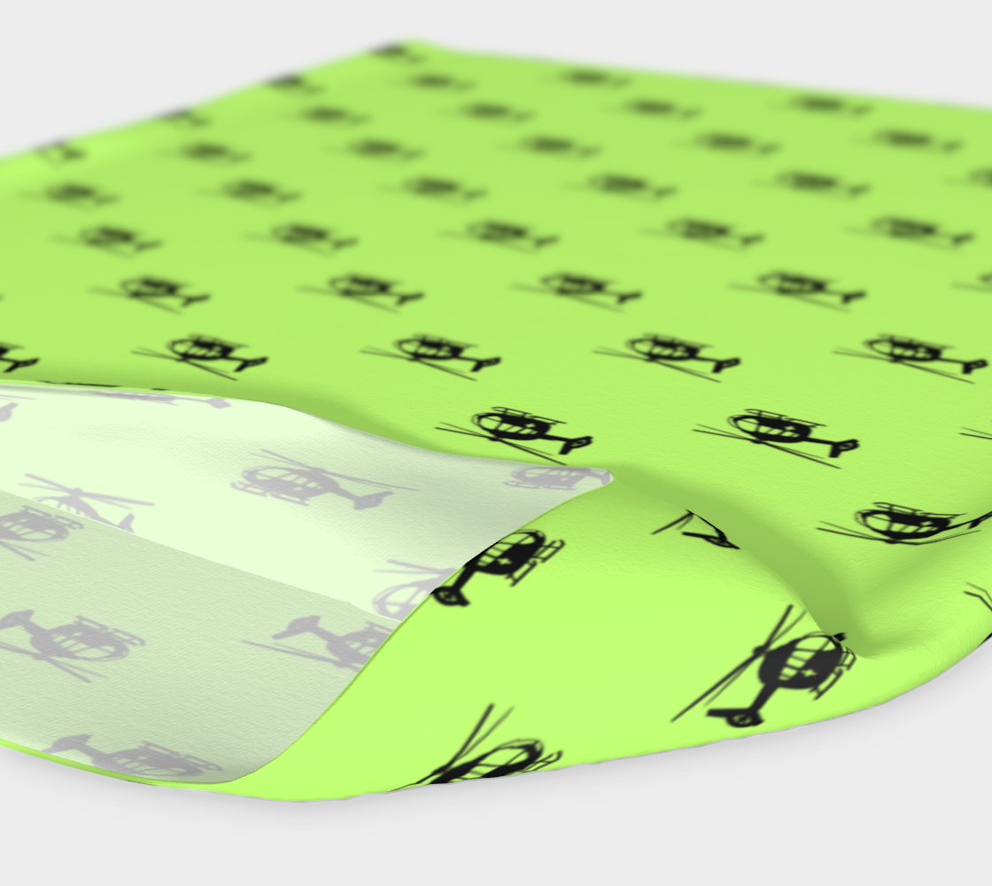 Lime green headband with helicopter pattern on a white background